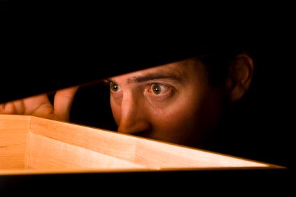 Man stares into a lit box
